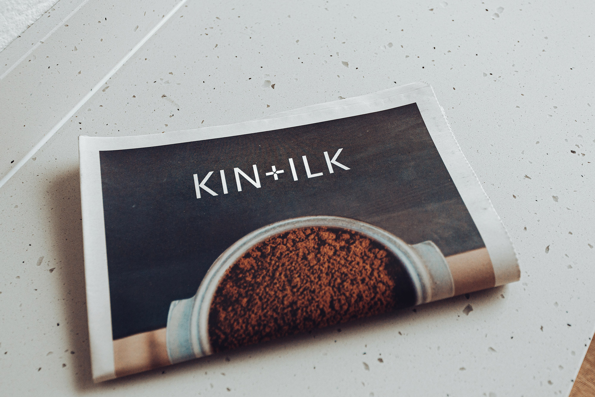 KIN+ILK paper folded in half